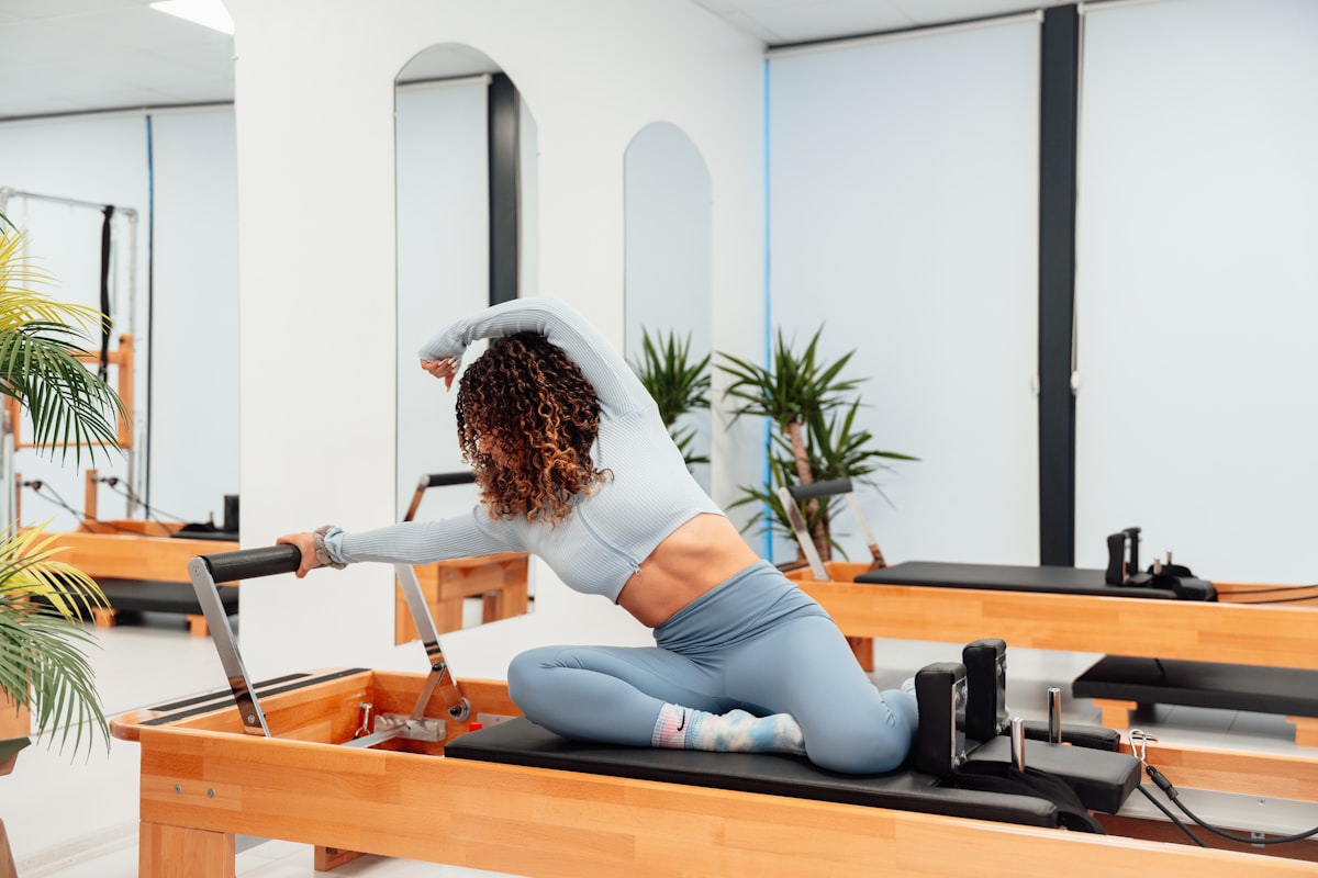 Woman doing Pilates home workout with resistance bands